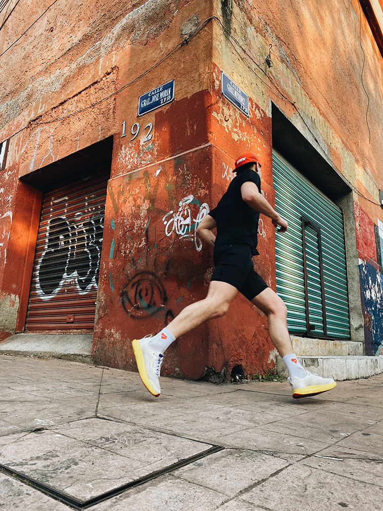 Man Running Around a Corner